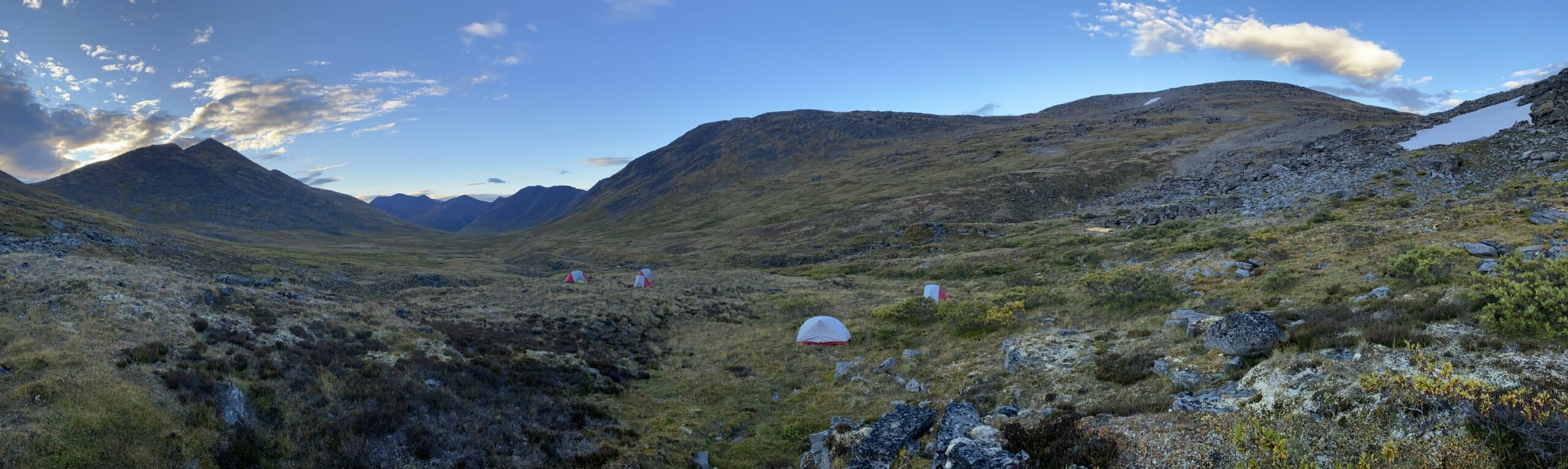 Serene campsite in mountainous landscape.