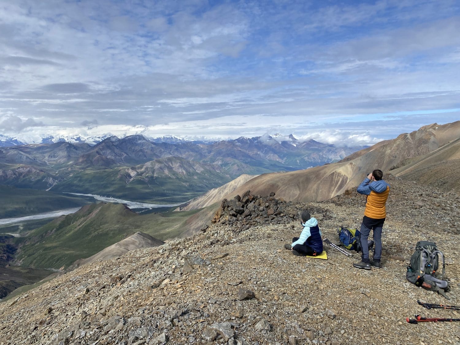 Hikers taking a break along a ridge in Kluane National Park