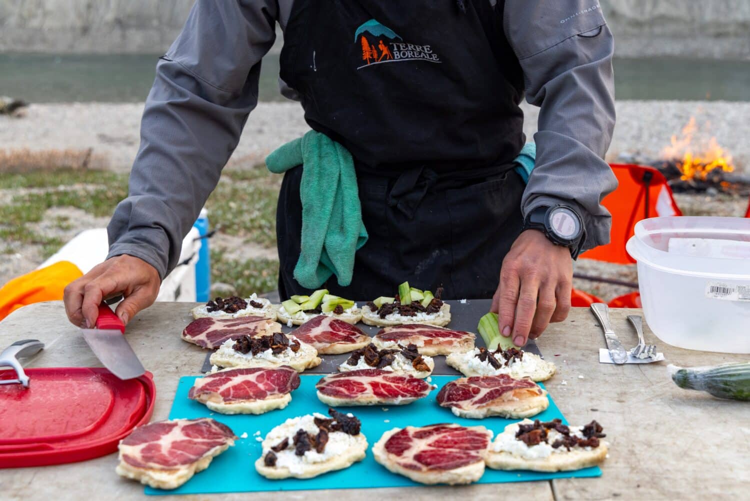 Preparing gourmet sandwiches outdoors
