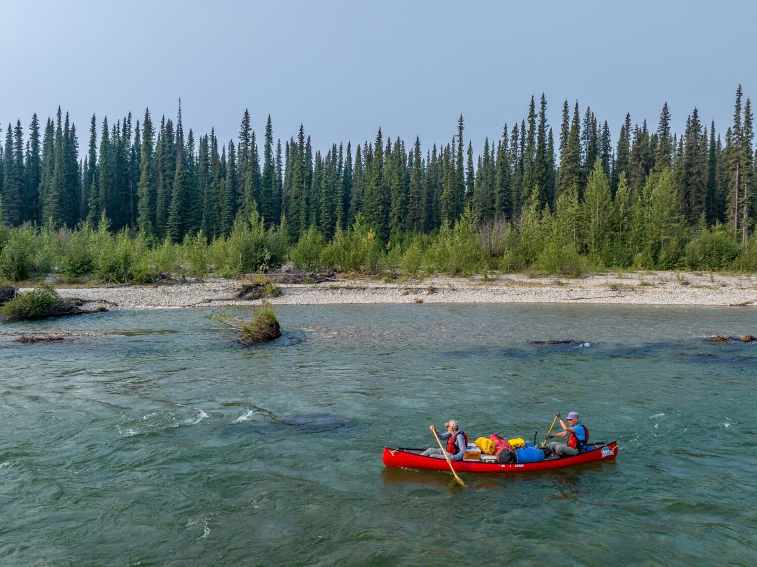 Two people kayaking on river