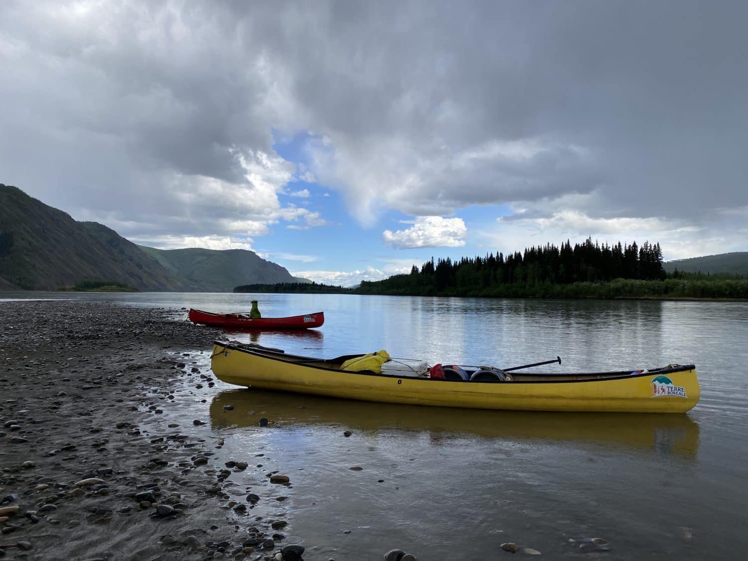 Two kayaks on a calm river